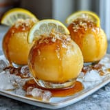 Bubbly Limoncello sorbet float with sparkling water, fresh lemon slices, and a mint garnish.