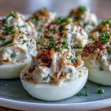 Golden Crab Cake Deviled Eggs with Old Bay seasoning, perfect for any party.