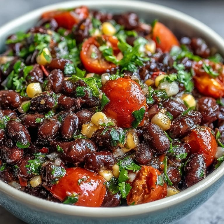 Vibrant Three-Ingredient Cowboy Caviar Dip featuring black beans, golden corn, and pico de gallo, ready for dipping with tortilla chips.
